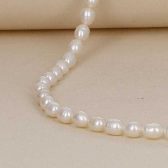 Wire of Oval White Pearls