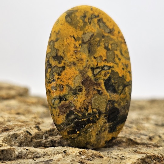 Stone of Calcite with Orpimento Cabochon Oval