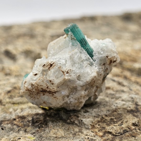 Emerald Stone on Calcite